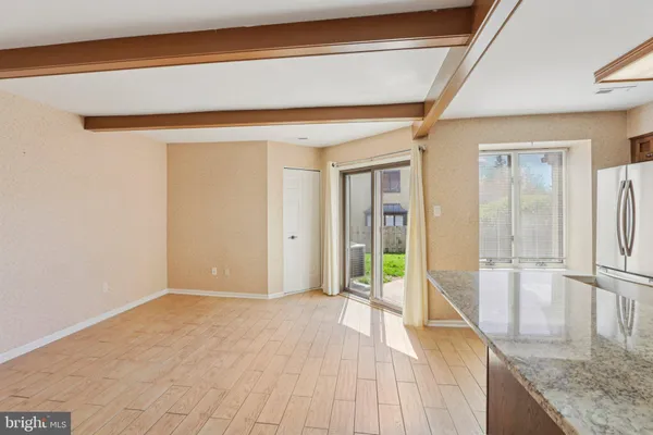 a view of hallway with wooden floor