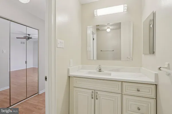 a bathroom with a sink double vanity and a mirror