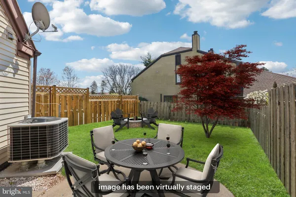 a view of a chairs and table in the patio