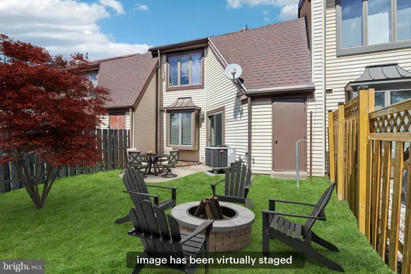 a view of a patio with table and chairs and potted plants