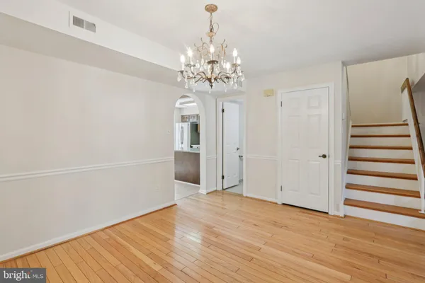 a view of a chandelier in an empty room