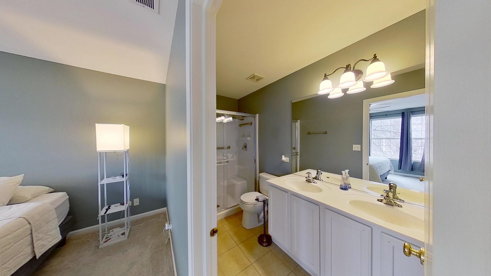 2418 Emily Lane Elgin, IL 60124 - Photo 13 of 27 a en suite bathroom with a double vanity sink and a mirror