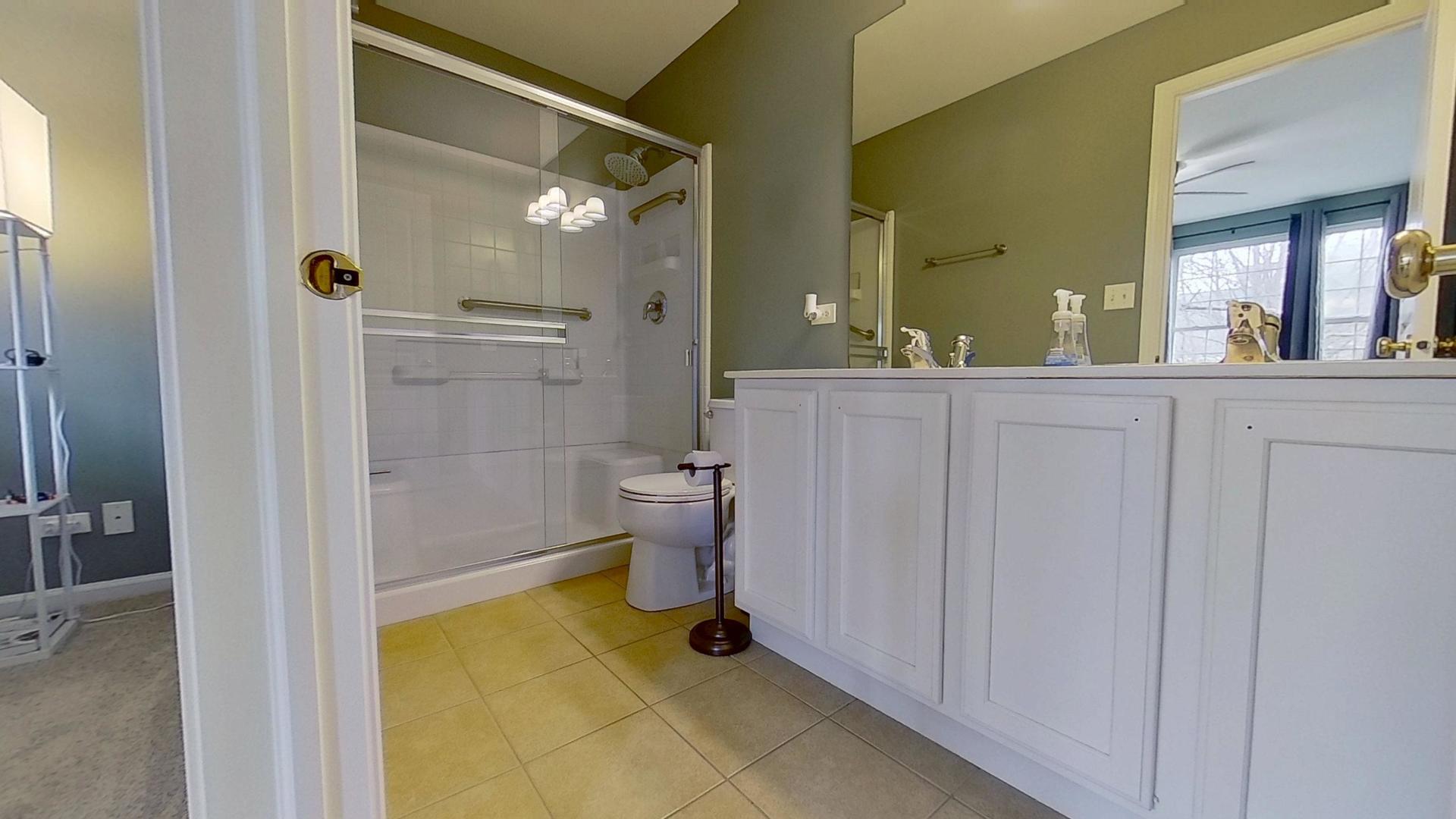 2418 Emily Lane Elgin, IL 60124 - Photo 14 of 27 a bathroom with a sink and a mirror
