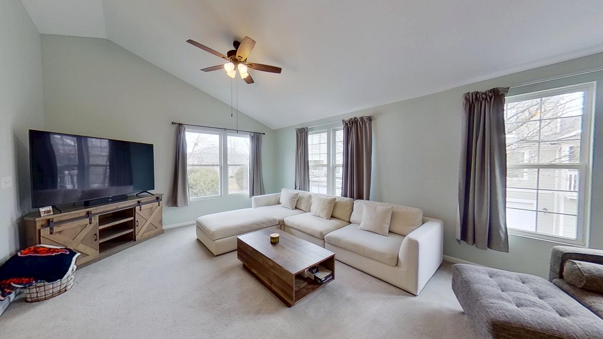2418 Emily Lane Elgin, IL 60124 - Photo 2 of 27 a living room with furniture and a flat screen tv