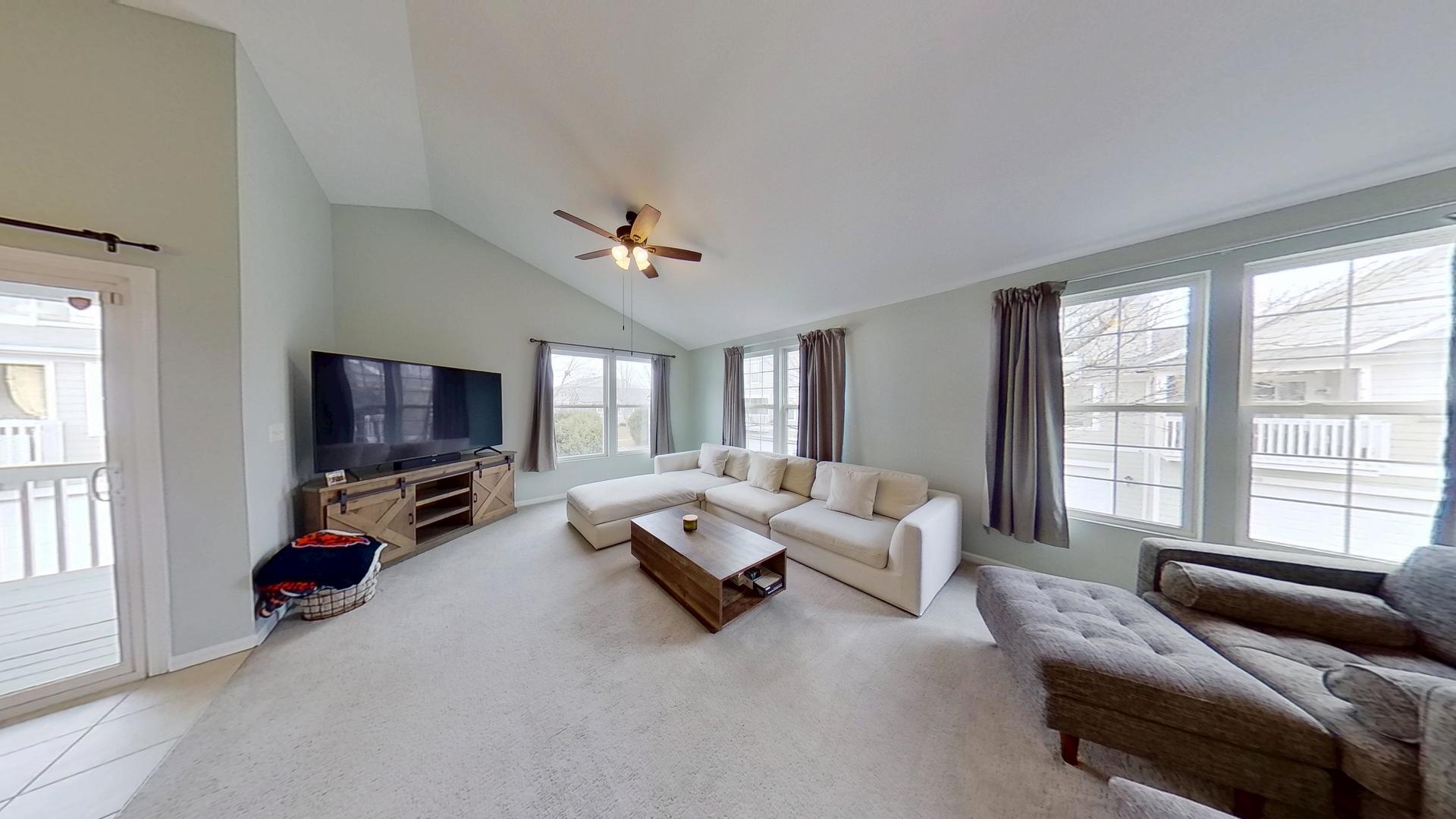 2418 Emily Lane Elgin, IL 60124 - Photo 3 of 27 a living room with furniture and a flat screen tv