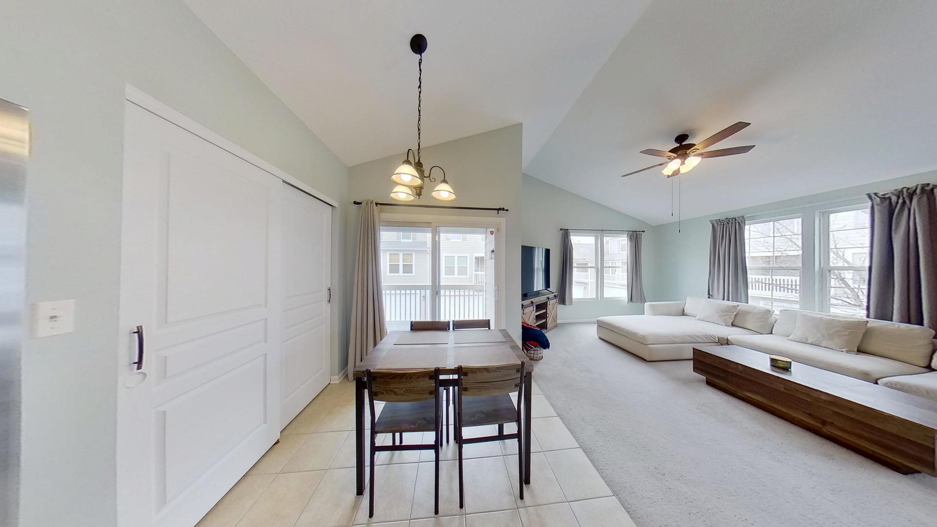 2418 Emily Lane Elgin, IL 60124 - Photo 4 of 27 a living room with furniture chandelier and a chandelier