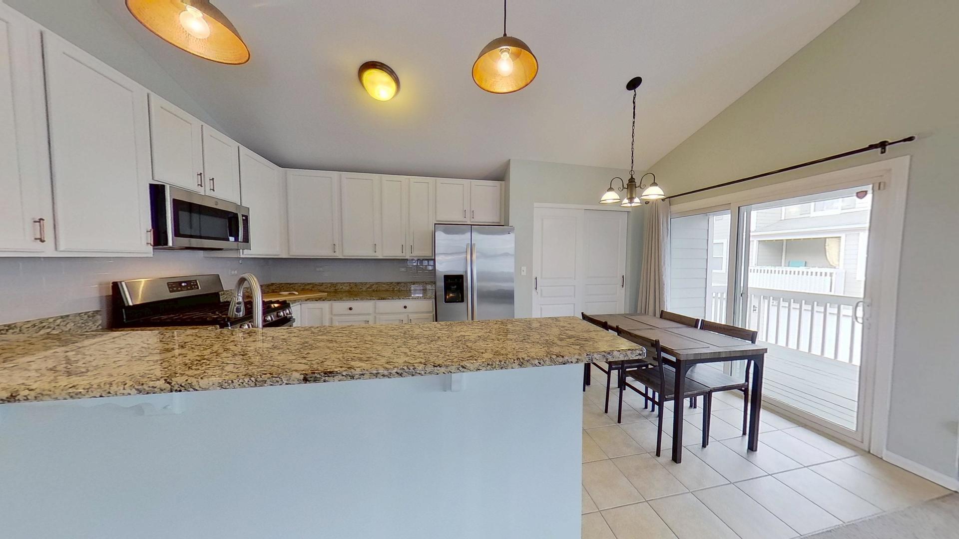 2418 Emily Lane Elgin, IL 60124 - Photo 7 of 27 a kitchen with a stove a refrigerator and a sink