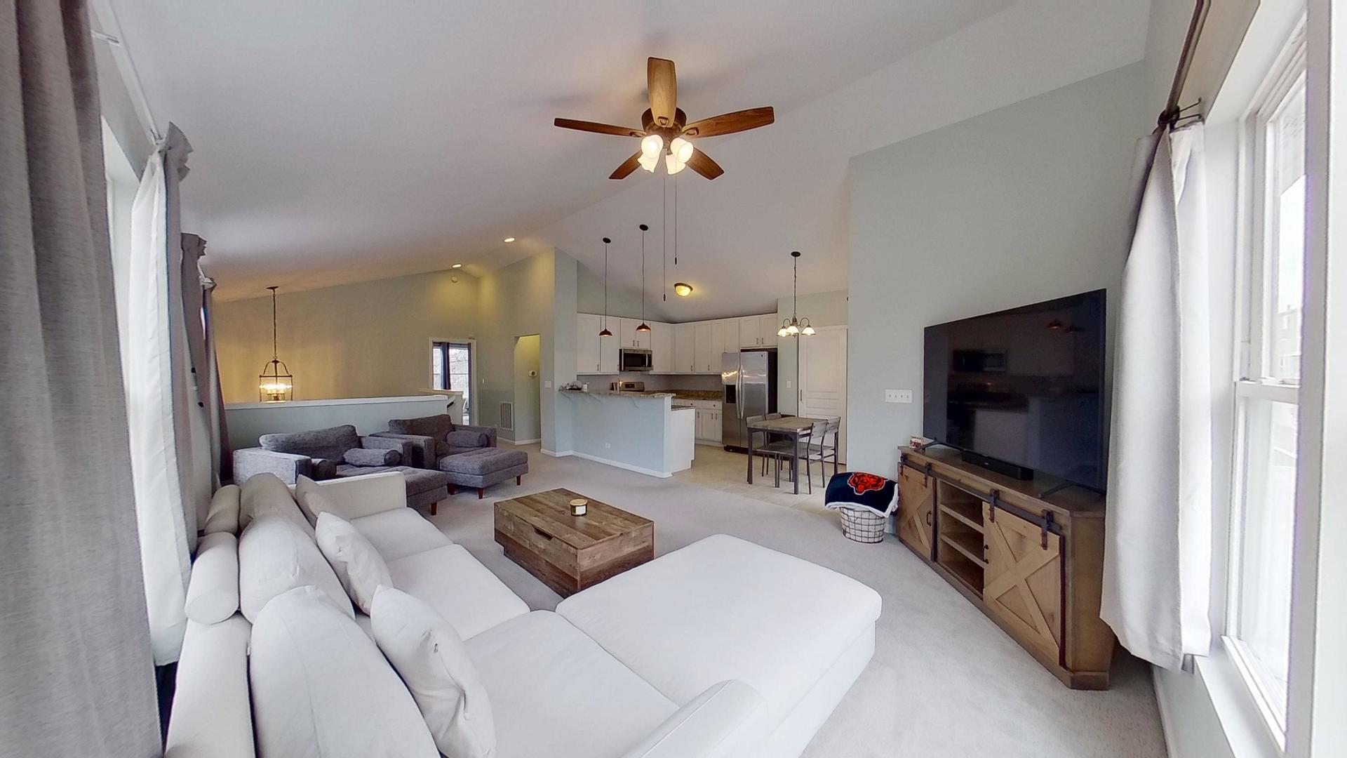 2418 Emily Lane Elgin, IL 60124 - Photo 9 of 27 a living room with furniture and a flat screen tv