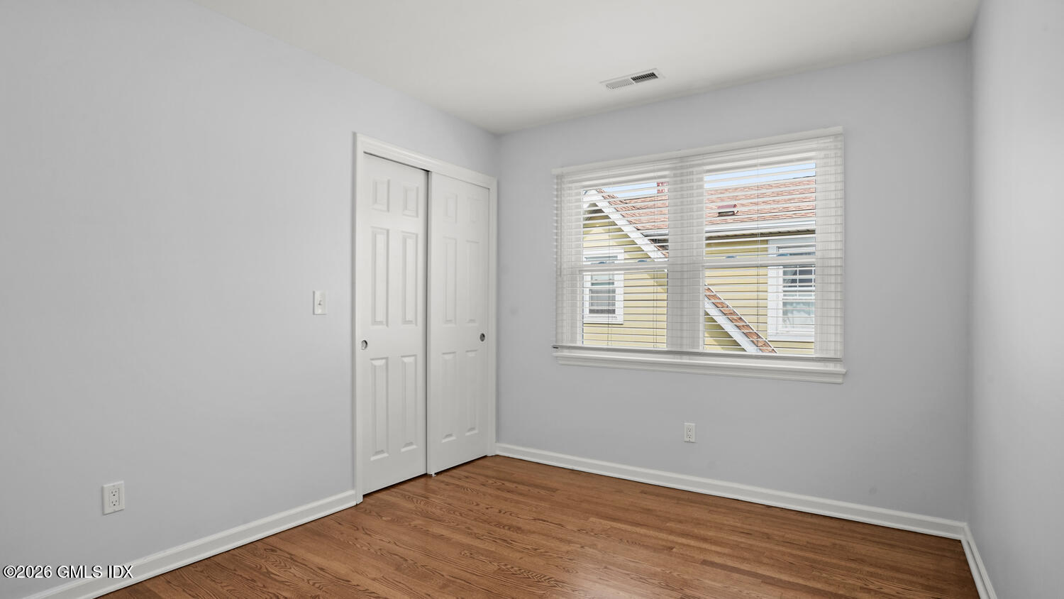 27 High Street, Unit B Greenwich, CT 06830 - Photo 13 of 19 a view of an empty room with wooden floor and a window