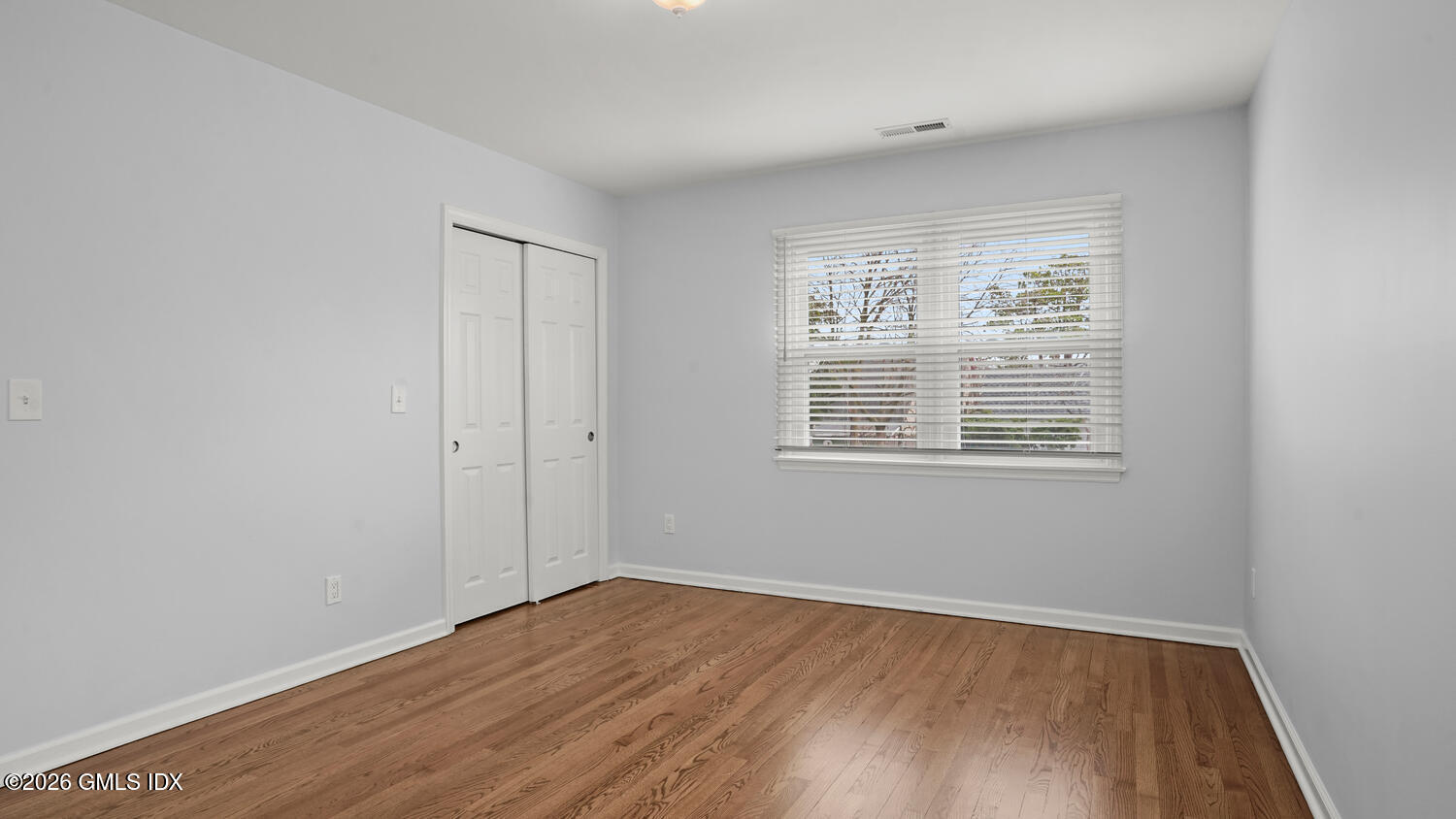 27 High Street, Unit B Greenwich, CT 06830 - Photo 6 of 19 wooden floor in an empty room with a window