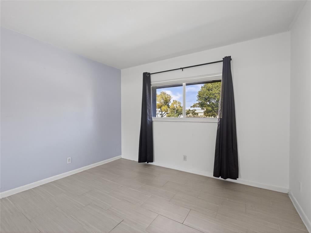 8400 West Sample Road, Unit 203 Coral Springs, FL 33065 - Photo 13 of 26 an empty room with window