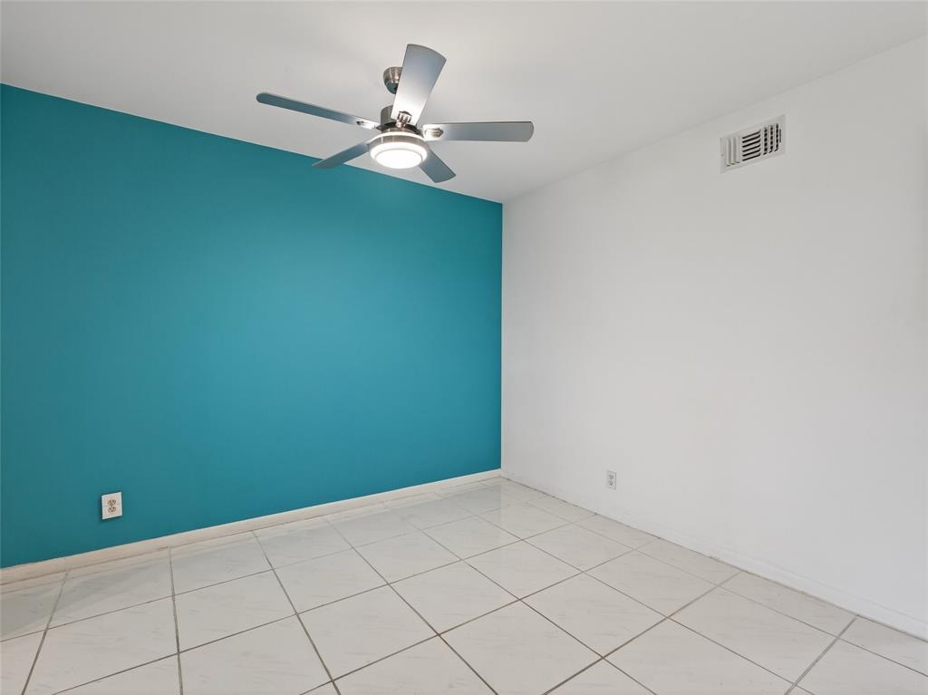 8400 West Sample Road, Unit 203 Coral Springs, FL 33065 - Photo 8 of 26 a view of a room with a fan and a fan