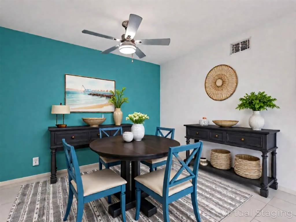 8400 West Sample Road, Unit 203 Coral Springs, FL 33065 - Photo 9 of 26 a view of a dining room with furniture and a chandelier fan