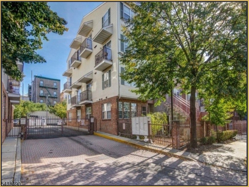 84 Union Street, Unit C2 Newark, NJ 07105 - Photo 3 of 13 a view of a brick building next to a yard