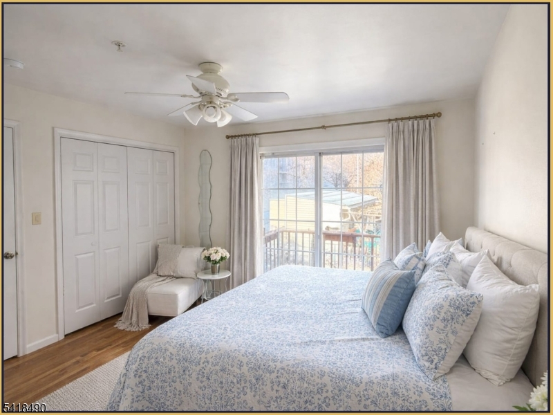 84 Union Street, Unit C2 Newark, NJ 07105 - Photo 8 of 13 a bedroom with a bed and a chandelier