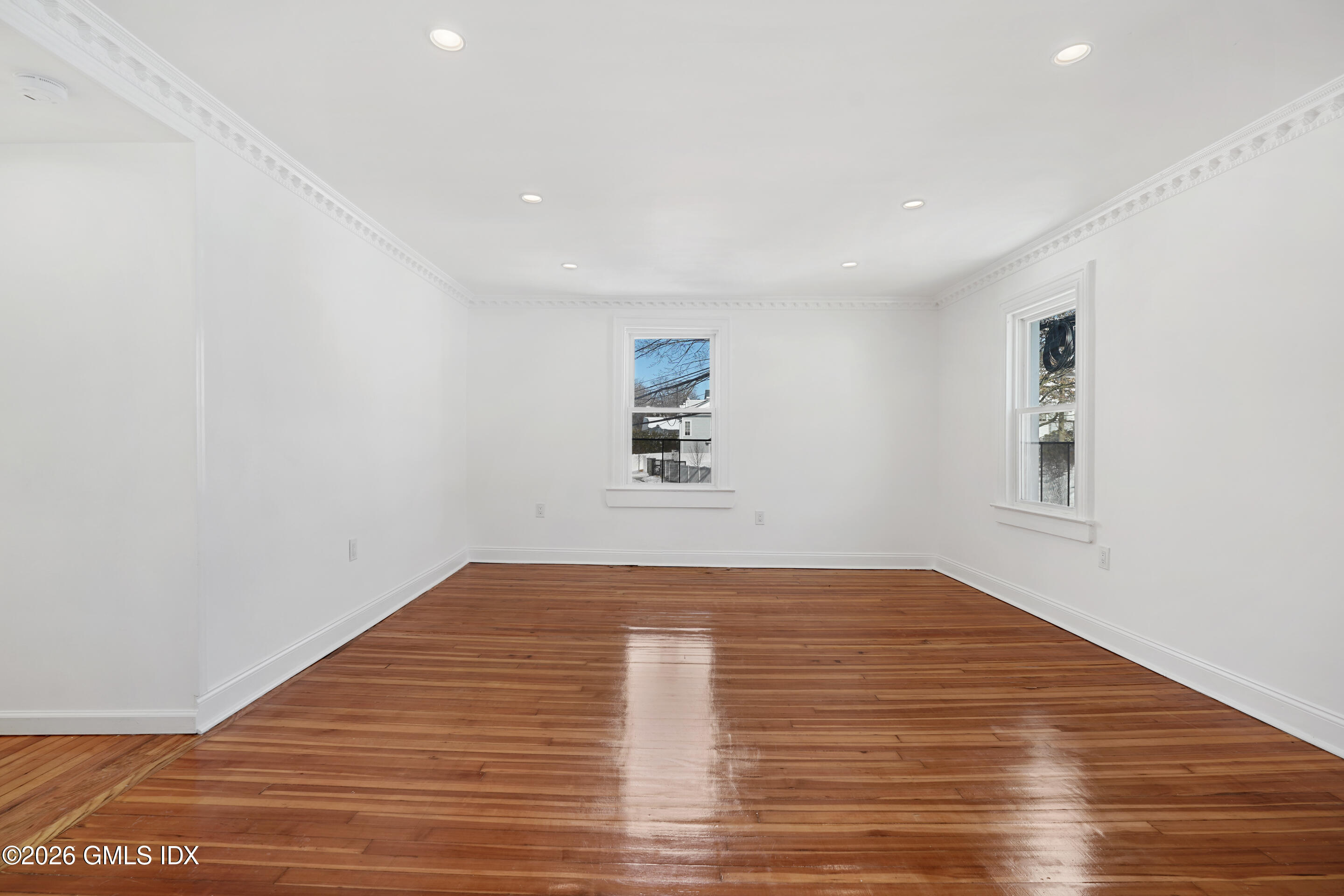 212 Davis Avenue, Unit B Greenwich, CT 06830 - Photo 3 of 10 a view of empty room with wooden floor