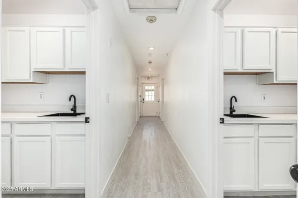 a bathroom with a shower sink and mirror