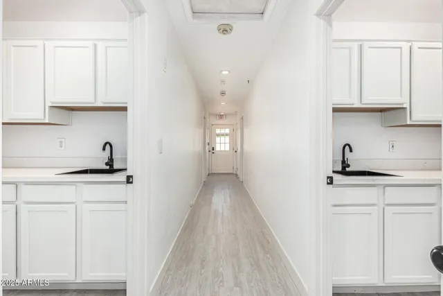 a bathroom with a shower sink and mirror