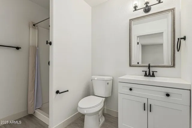 a view of a bathroom with a sink and a mirror