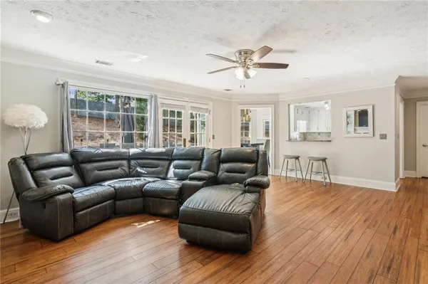a living room with furniture and a large window
