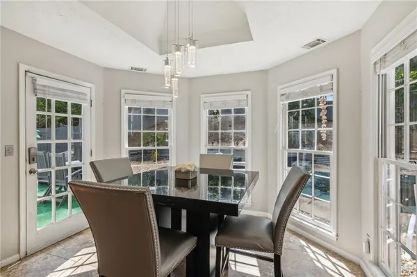 a view of a dining room with furniture window and outside view
