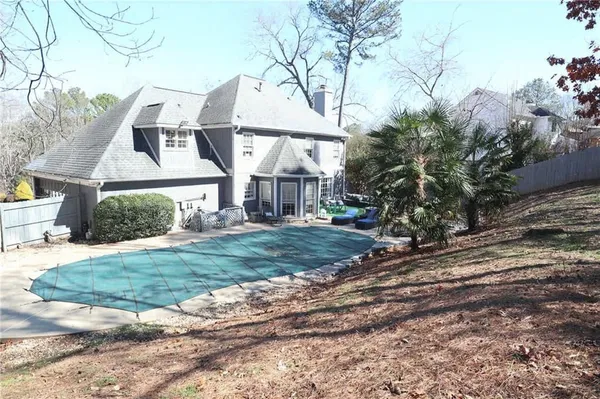 a view of a house with a yard