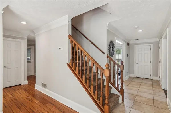 a view of an entryway with wooden floor