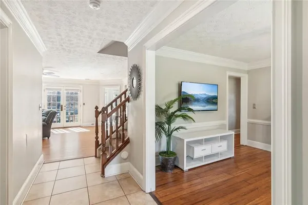 a view of entryway and hall with wooden floor