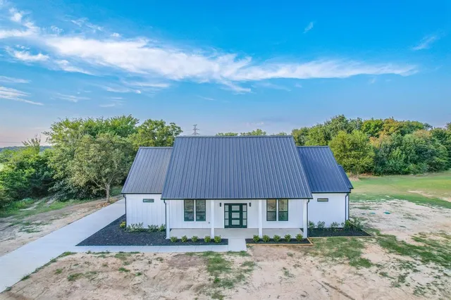 front view of a house with a yard