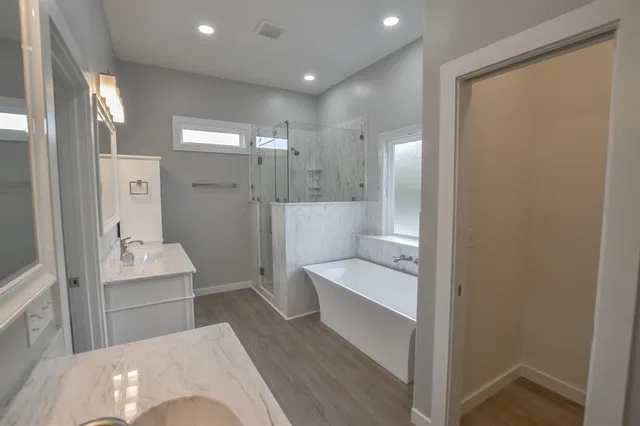 a bathroom with a bathtub and a sink