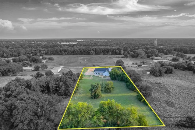 a view of a yard with a swimming pool