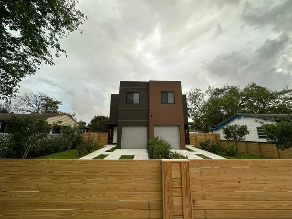 a view of a house with basketball court