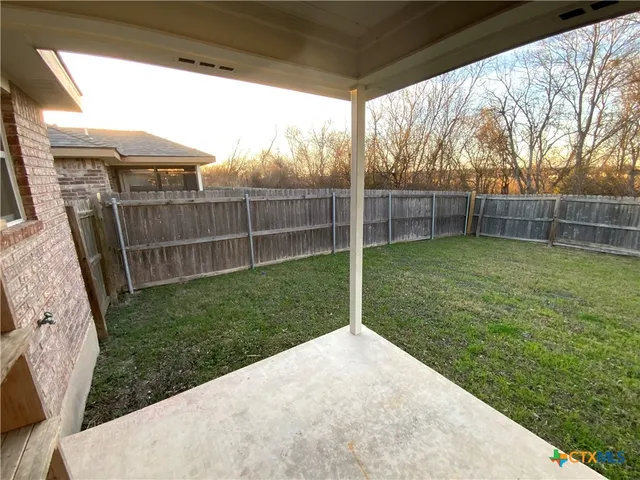 a view of a backyard with a tub