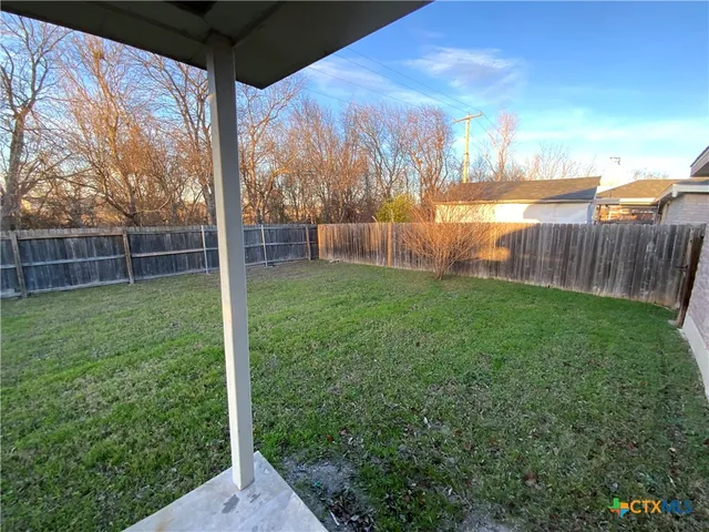 a view of a backyard with a garden