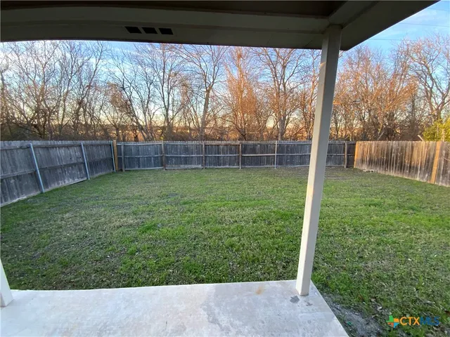 a view of a backyard with a garden