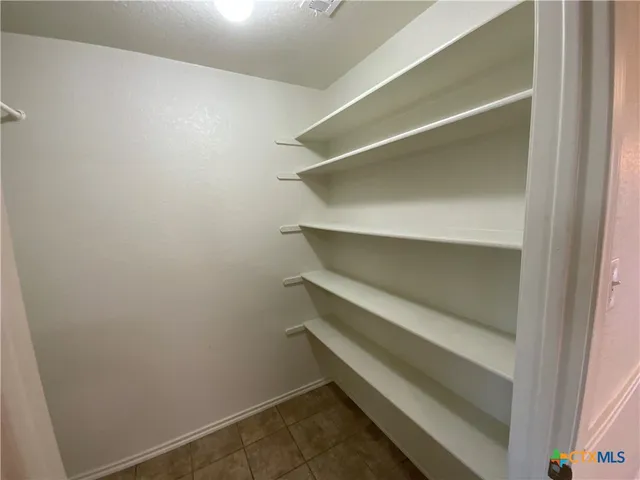 a storage room with washer and dryer