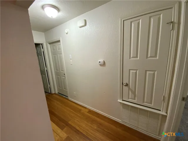 a view of a hallway with closet area