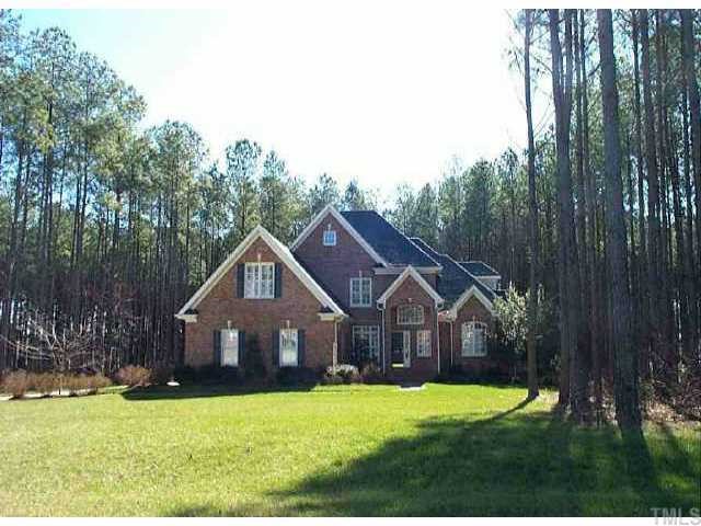 4756 Sharpstone Lane Raleigh, NC 27615 - Photo 1 of 1 a front view of a house with yard and green space