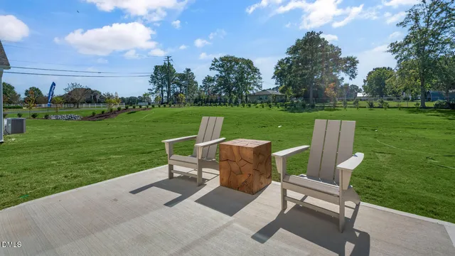 a view of a table and chairs in the garden