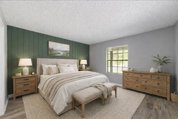 a bedroom with a bed and a dresser