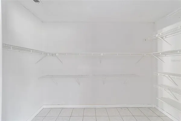 a view of an empty walk in closet
