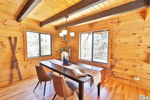 a dining room with furniture and windows