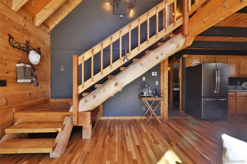 a view of an entryway with wooden floor