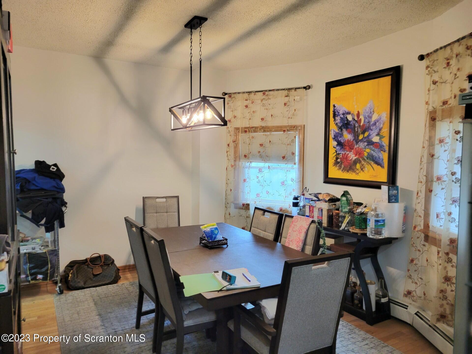 1620 Myrtle Street Scranton, PA 18510 - Photo 11 of 29 a view of a dining room with furniture and chandelier