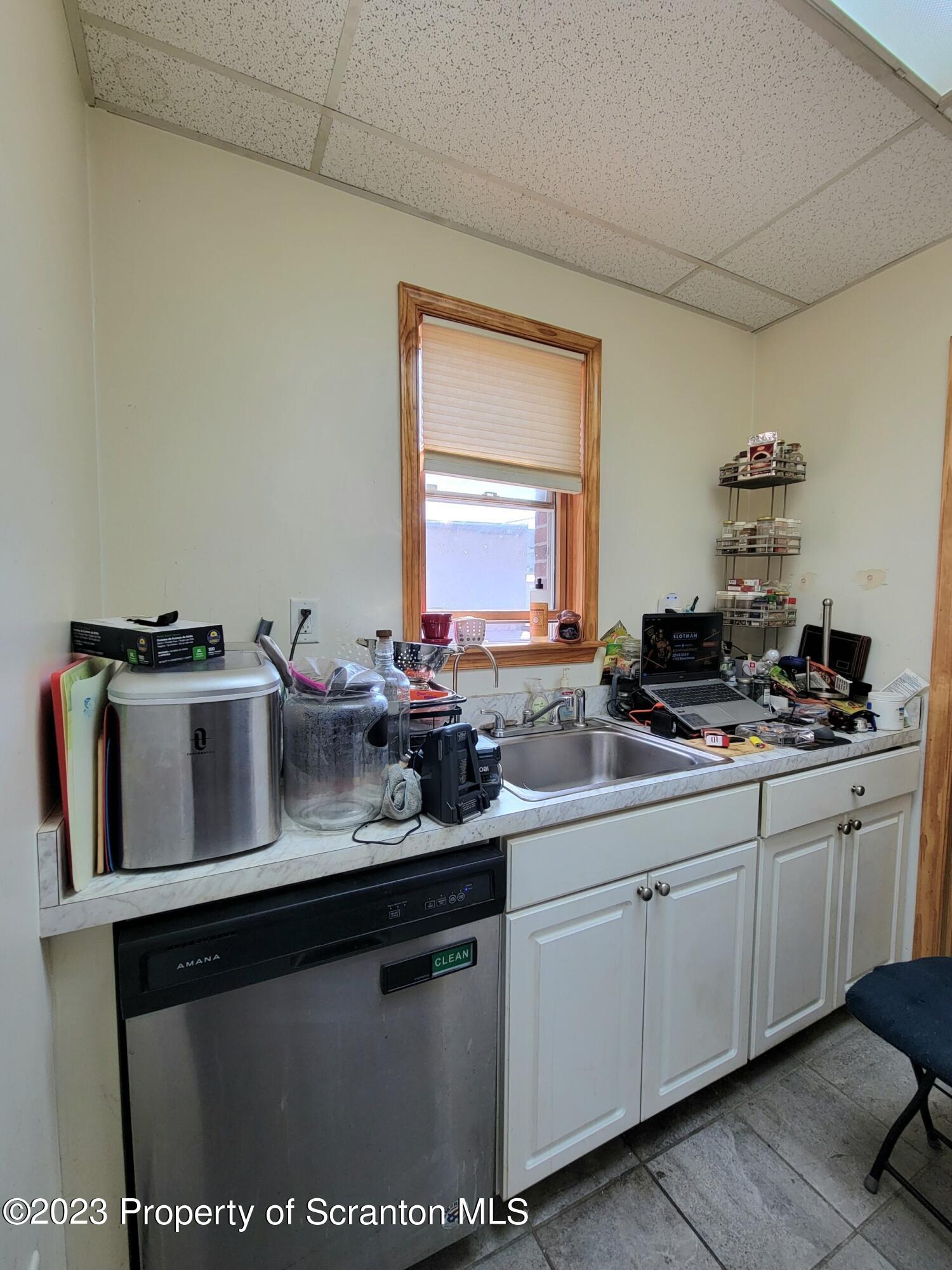 1620 Myrtle Street Scranton, PA 18510 - Photo 13 of 29 a kitchen with a sink and cabinets