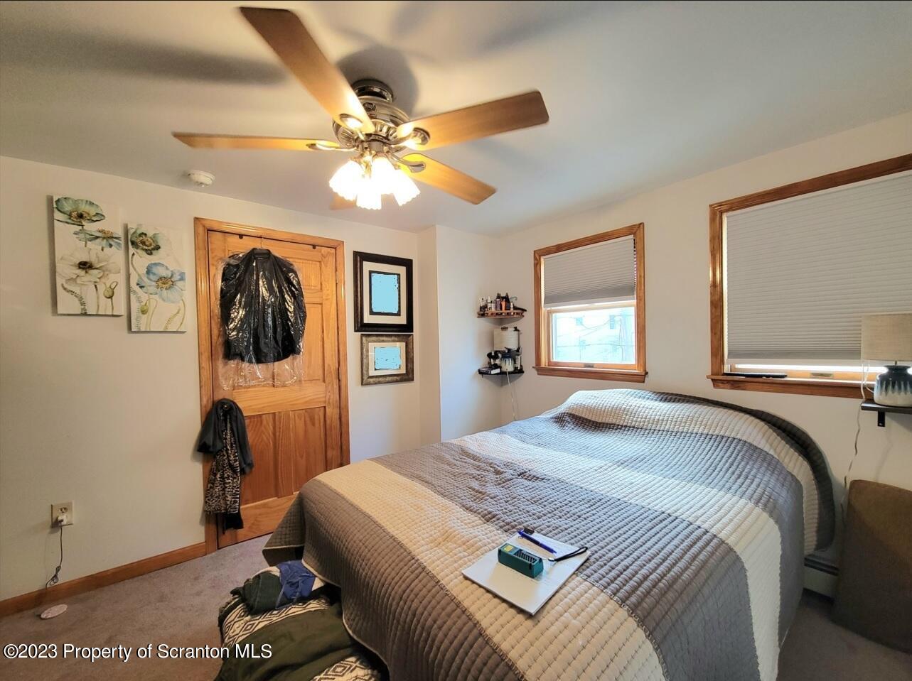1620 Myrtle Street Scranton, PA 18510 - Photo 23 of 29 a bedroom with a bed and a chandelier