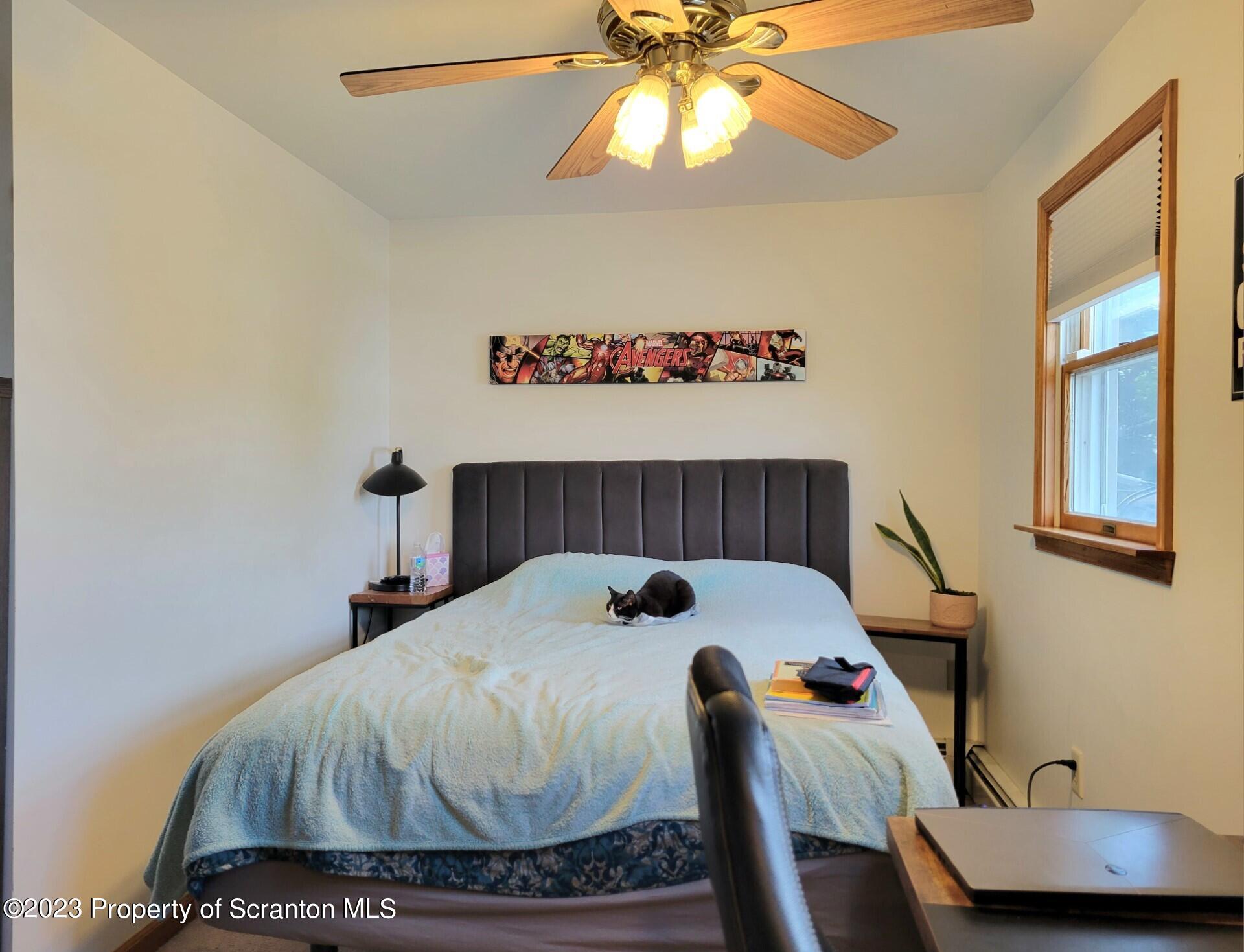 1620 Myrtle Street Scranton, PA 18510 - Photo 25 of 29 a bedroom with a bed and a chandelier