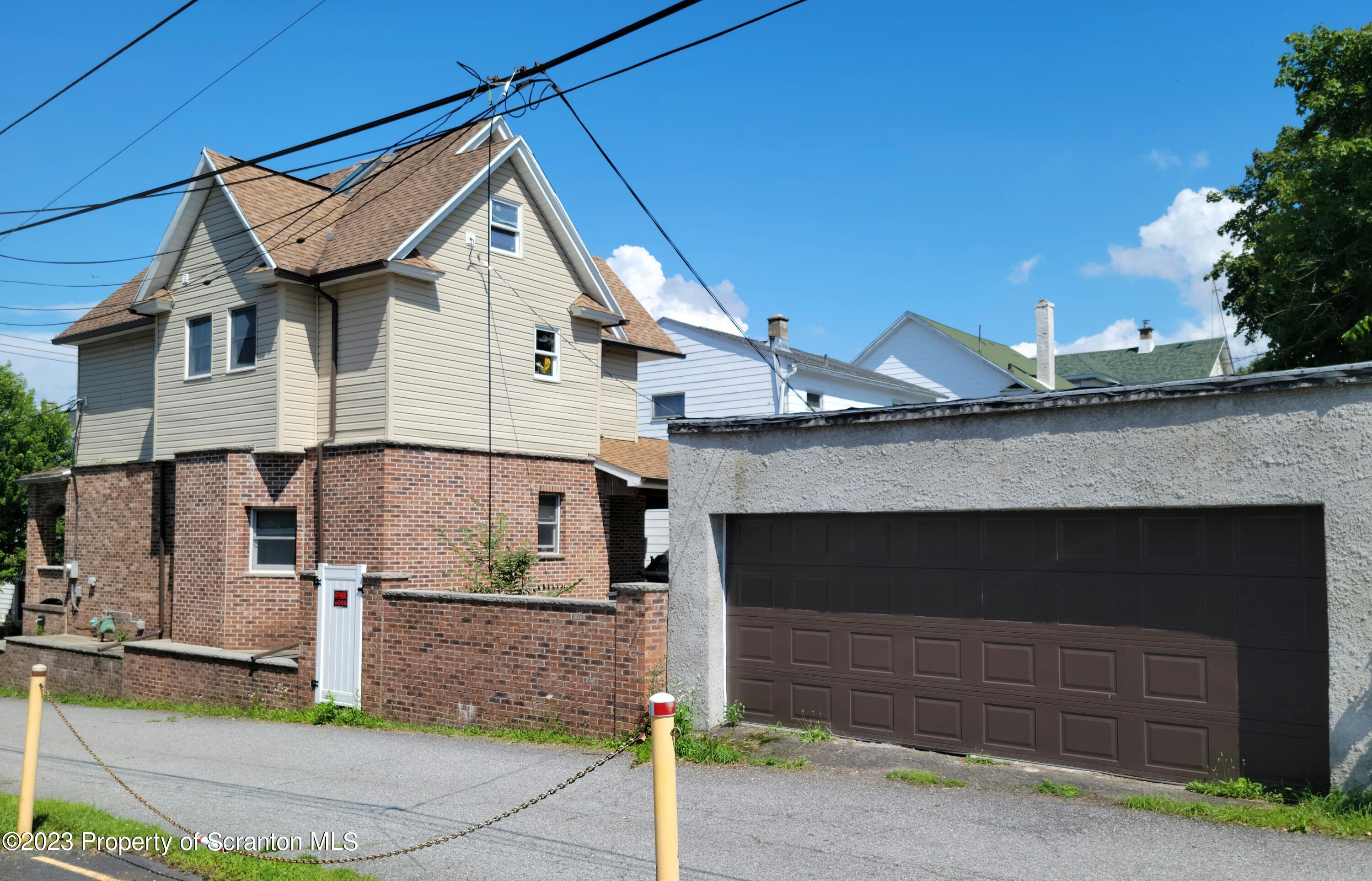 1620 Myrtle Street Scranton, PA 18510 - Photo 6 of 29 a front view of a house with garage