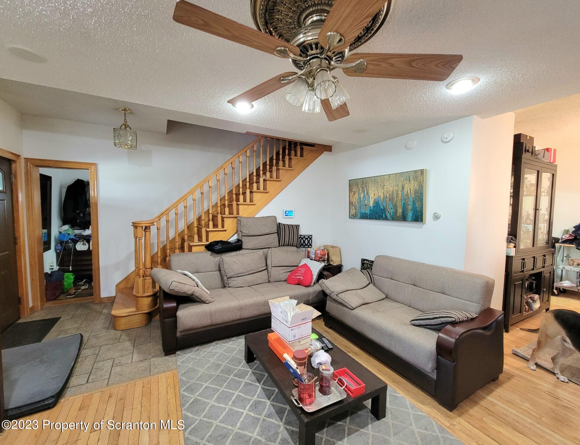 1620 Myrtle Street Scranton, PA 18510 - Photo 8 of 29 a living room with furniture and a chandelier