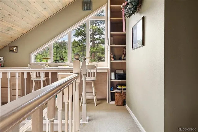 a view of a balcony with chairs